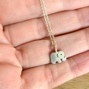 Sterling silver chain with little elephant pendant.